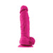 Bright pink 5-inch silicone dildo with realistic texture and suction cup base for hands-free use.