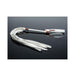 White vegan leather whip with multiple tails, a sleek handle, and an adjustable wrist strap with metal accents on a reflective black surface.