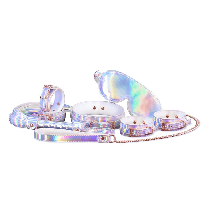 Rainbow holographic bondage kit with cuffs, collar, leash, blindfold, flogger, and rose gold hardware.