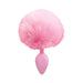 Pink silicone anal plug with a large fluffy pink faux fur bunny tail attached.