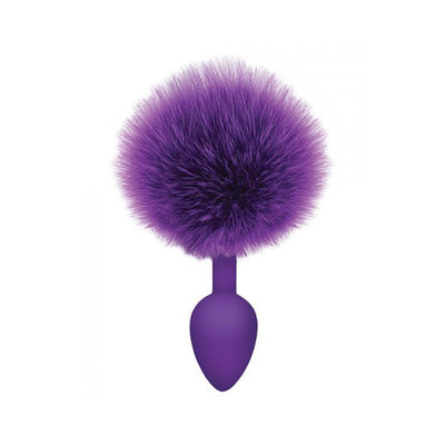 Purple silicone anal plug with large fluffy faux fur bunny tail attachment.
