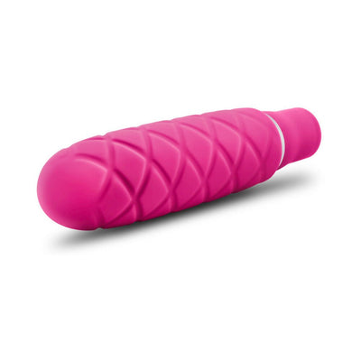 Compact pink silicone mini stimulator with textured diamond pattern and smooth rounded tip.