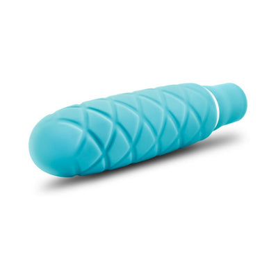 Periwinkle blue compact stimulator with textured silicone surface and smooth satin finish.