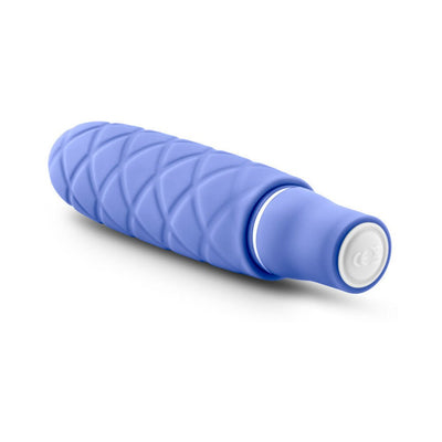 Periwinkle blue mini stimulator with textured silicone surface and smooth satin finish, compact and travel-friendly design.