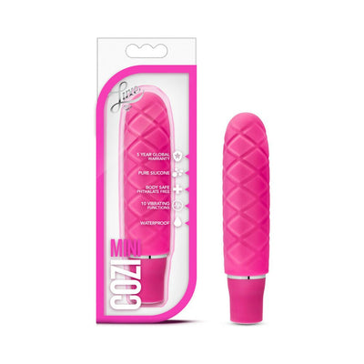 Pink textured mini vibrator with satin finish shown in and out of clear retail packaging.
