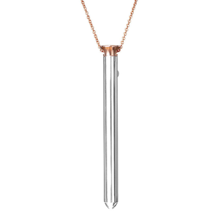 Rose gold chain necklace with sleek silver cylindrical pendant, modern and elegant design.