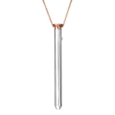 Rose gold chain necklace with sleek silver cylindrical pendant, modern and elegant design.
