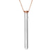 Rose gold chain necklace with sleek silver cylindrical pendant, modern and elegant design.
