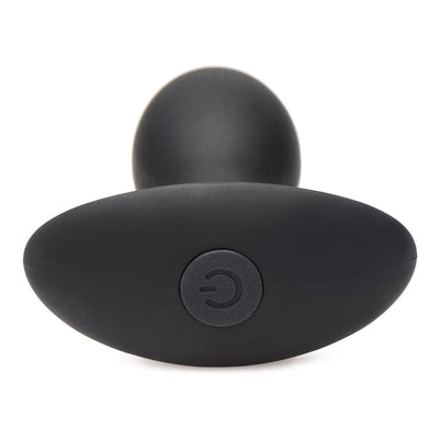 Black silicone medium-sized vibrating anal plug with flared base and power button detail, shown on white background.