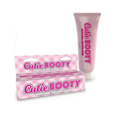 Cutie Booty Brightening Cream tube and matching pink checkered box packaging on white background.