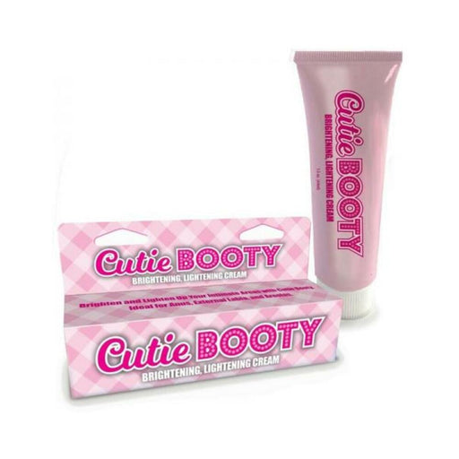 Cutie Booty Brightening Cream tube and matching pink checkered box packaging on white background.