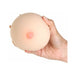 Hand holding a realistic soft silicone breast stroker with detailed nipple design against a white background.