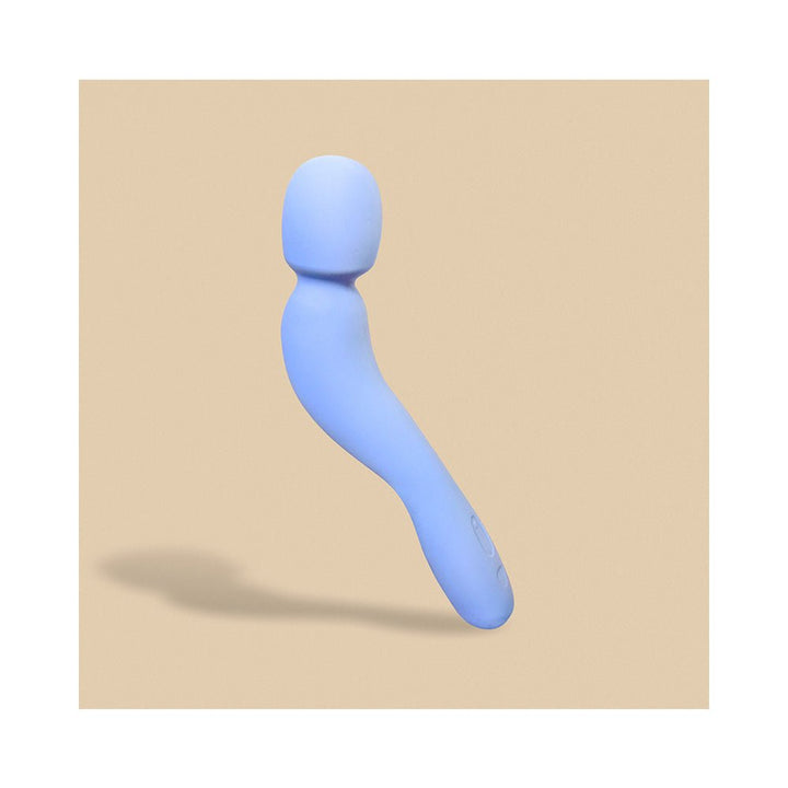 Light blue curved wand vibrator with a rounded head and ergonomic handle on a beige background.