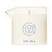 Dame Massage Oil Candle in clear glass jar with easy-pour spout and soft touch scent label.