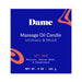 Dame Massage Oil Candle box in blue with orange accents, featuring soft touch scent with benzoin, guaiac wood, and sandalwood.