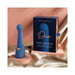 Blue silicone Deia The Couple two-in-one G-spot and bullet massager with packaging on soft fabric background.