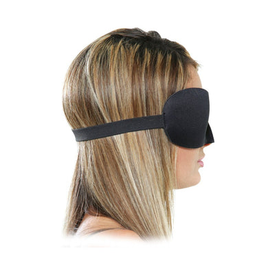 Side view of a woman wearing a black neoprene padded sensory deprivation mask with an adjustable elastic strap.