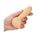 Hand holding a beige soft gel stress ball shaped with a playful design.