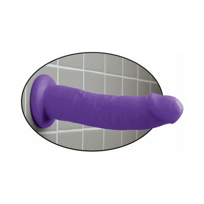 Purple Dillio dildo with suction cup base attached to a tiled wall surface.