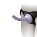 Close-up of a lavender silicone dildo attached to a black adjustable harness with a suction cup docking plate.