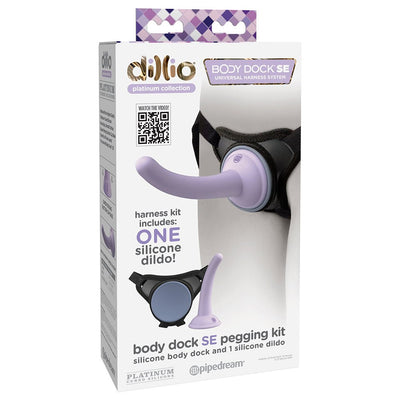 Dillio Platinum Body Dock SE pegging kit with lavender silicone dildo and black universal harness system packaging.