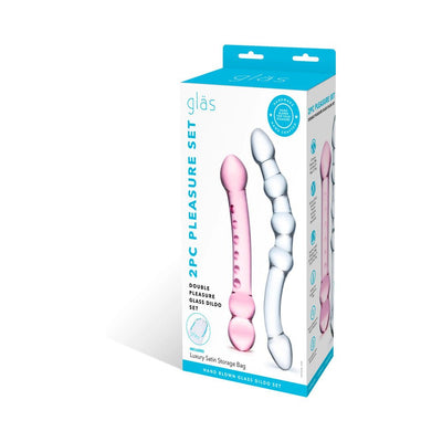 Packaging of Double Pleasure Glass Dildo Set featuring two uniquely shaped, hand-blown glass dildos in pink and clear with a luxury satin storage bag.