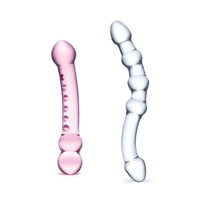 Set of two premium glass dildos, one pink with smooth and textured bumps, one clear with curved, segmented design.
