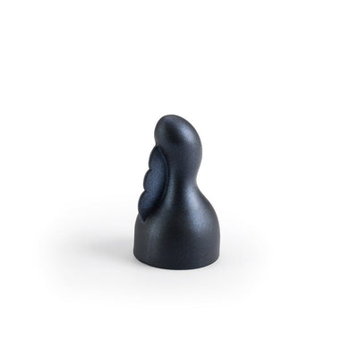 Black silicone clitoral attachment for Doxy Number 3 with textured flutter design on white background.