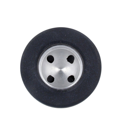 Top view of Doxy by Nexus clitoral attachment in black silicone with metal center and four attachment points.