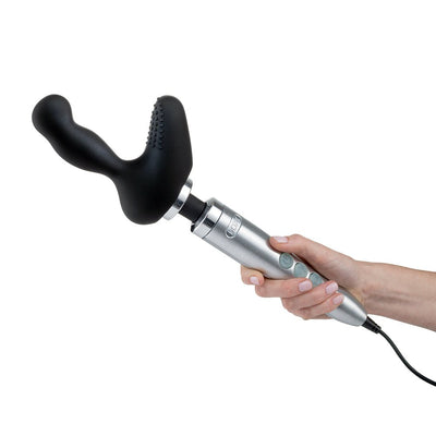 Hand holding a silver Doxy No.3 wand massager fitted with a black prostate attachment with textured stimulation points.