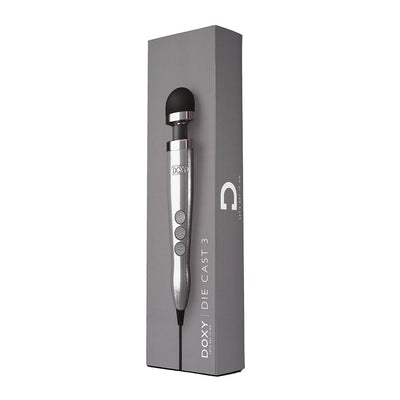Doxy Die Cast 3 compact wand vibrator in silver with black silicone head displayed on gray packaging box.