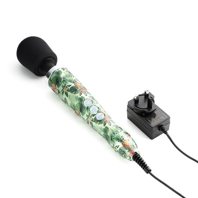 Doxy Die Cast Massager with pineapple print handle, black silicone head, and attached power adapter on white background.