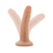 Vanilla-colored 5.5 inch realistic dildo with suction cup base shown in upright and angled positions on white background.