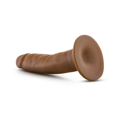 Vanilla-colored 5.5 inch realistic dildo with suction cup base, textured surface, and smooth finish.