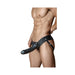 Male model wearing a black 6 inch hollow strap-on with adjustable waistband and thigh straps.