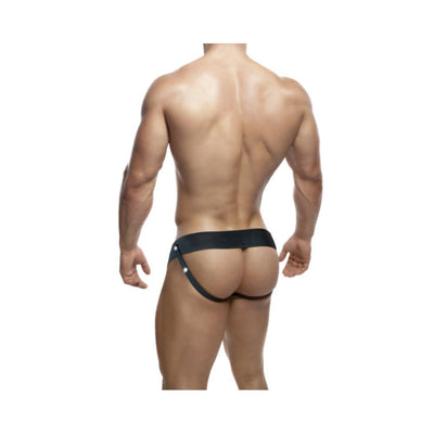 Rear view of a man wearing a black adjustable strap-on harness with a 6-inch hollow dildo attachment.