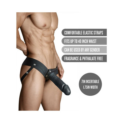 Male model wearing a black 7-inch hollow strap-on with adjustable elastic straps and detailed product features.