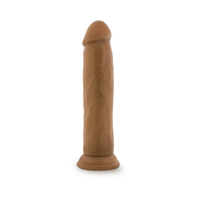 Realistic 9.5 inch vanilla-colored dildo with suction base and detailed texture for hands-free use.