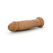 Realistic 9.5 inch vanilla-colored dildo with suction base on white background