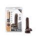 Dr. Daniel realistic silicone dildo with suction cup base in dark brown next to its retail packaging.