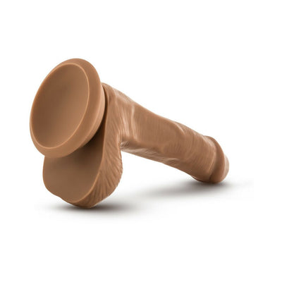 Tan realistic dildo with suction cup base and detailed texture, designed for versatile and hands-free use.