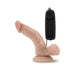 Realistic vanilla-colored vibrating dildo with suction cup base and black wired remote control on white background.