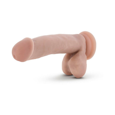 Beige realistic dildo with suction cup base and attached balls, designed for versatile hands-free use.