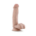Beige realistic dildo with detailed texture and suction cup base standing upright on white background.