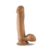 Tan realistic dildo with suction cup base and detailed texture including balls, standing upright on white background.