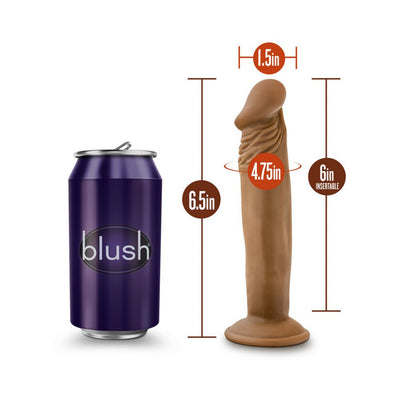 Vanilla-colored 6-inch realistic dildo with suction base shown next to a soda can for size comparison.