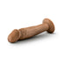 Vanilla-colored realistic 6-inch dildo with suction base lying on white background.