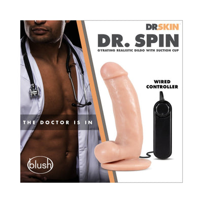 Realistic flesh-toned gyrating dildo with suction cup base and wired controller beside a shirtless man in a doctor's coat with stethoscope
