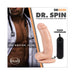 Realistic flesh-toned gyrating dildo with suction cup base and wired controller beside a shirtless man in a doctor's coat with stethoscope