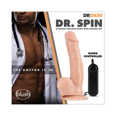 Realistic flesh-toned gyrating dildo with suction cup base and wired controller next to a man in a doctor’s coat and stethoscope.